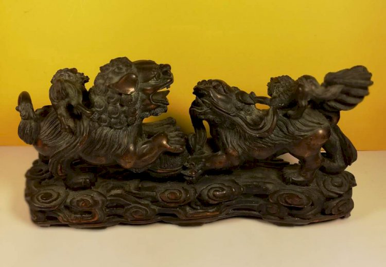 I008. Mud Sculpture of Two Lions stepping on Round Ball